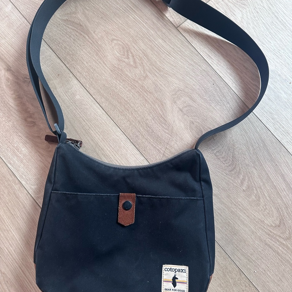 Cotopaxi Black Canvas Perla Bag